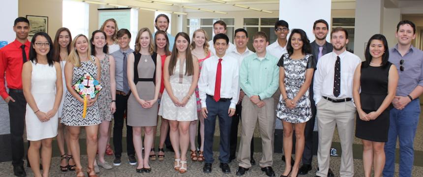 36 seniors stand together, having graduated with degrees in Chemistry