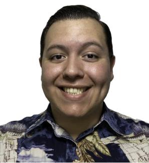Headshot of Adrian Torres, speaker, man with dark hair and patterned shirt