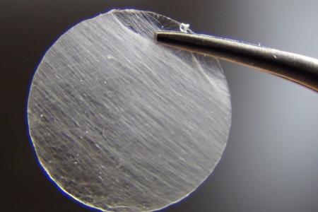 Detail of a nanofiber spool produced by an ultra-fast, touch-spinning technology which can produce thousands of yards of nanofibers in a matter of minutes.