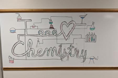 Image of a whiteboard with a drawing that says "I love Chemistry"