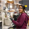 Portrait of speaker Geeta Goyal at work in the lab